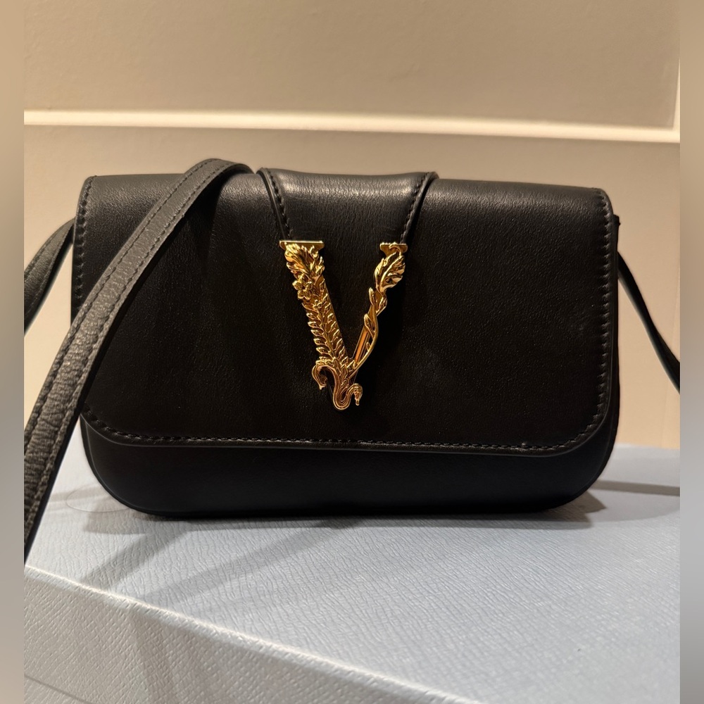 VERSACE crossbody leather bag with gold hardware. Lightly worn